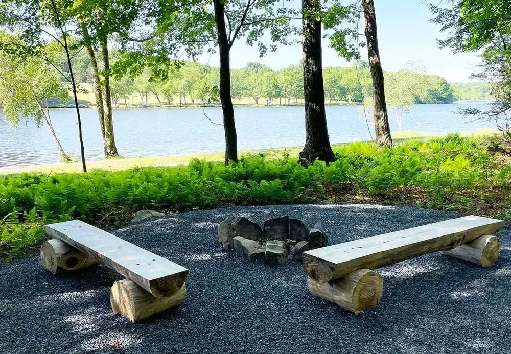 Lakeview Cabin 3 lakeside fire pit with benches and water view