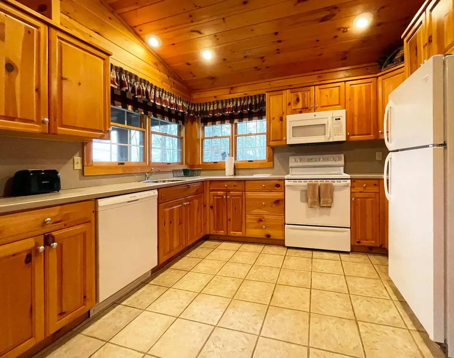 Full kitchen with dishwasher inside Hemlock Cabin #55