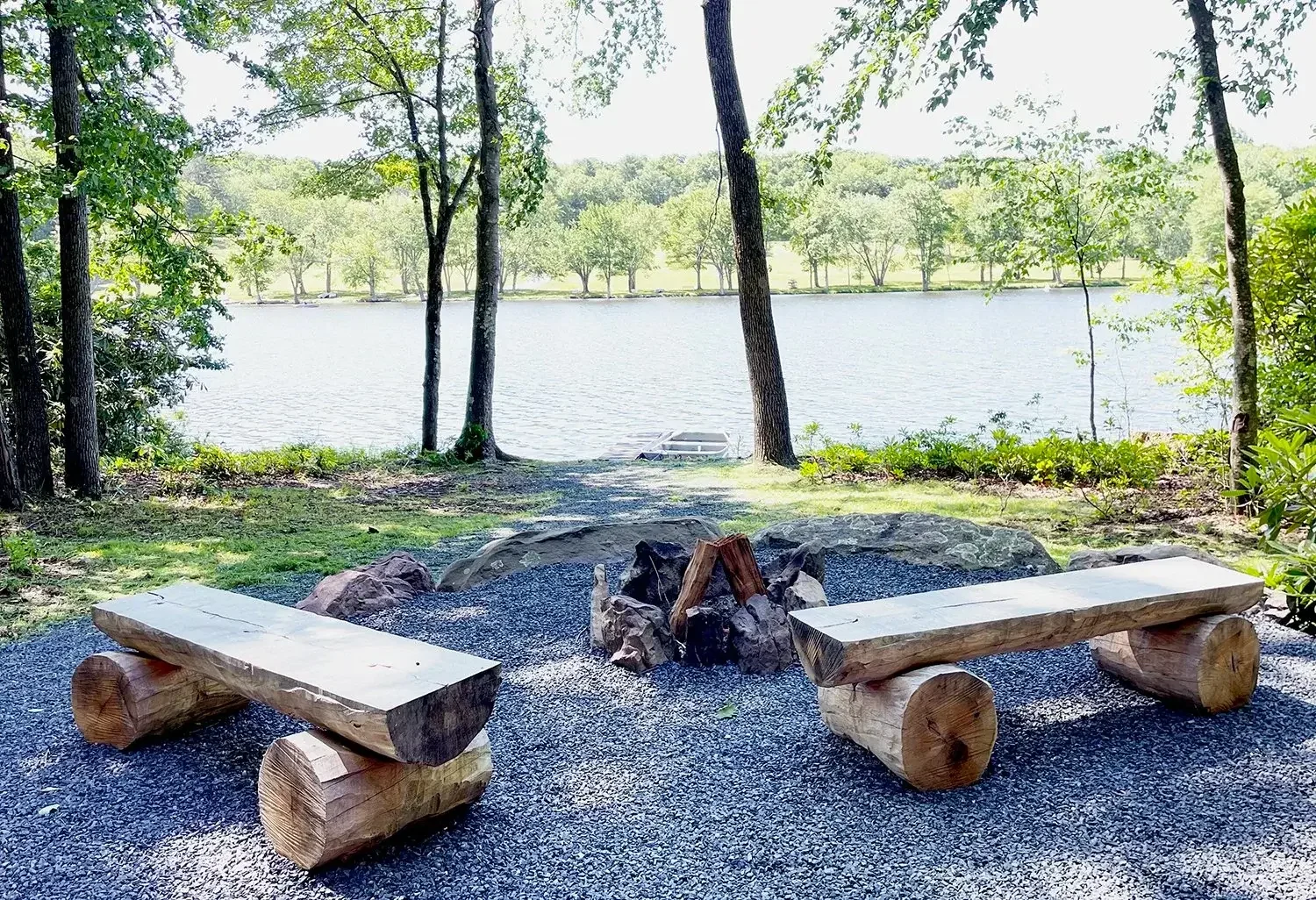 Lakeview Cabin 24 fire pit with lake view and log benches