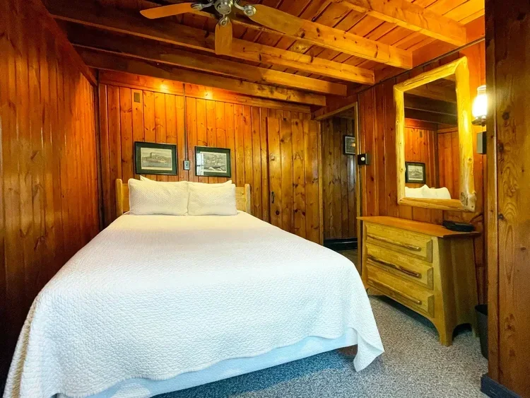 Main-floor queen bedroom inside Lakeview Cabin #16