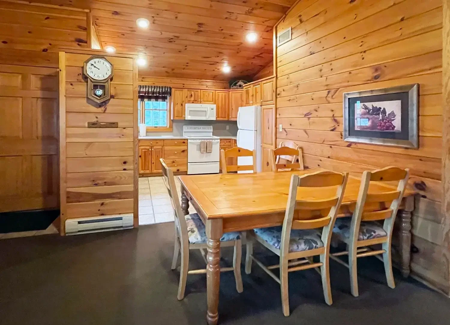 Dining area and kitchen inside Hemlock Cabin #55