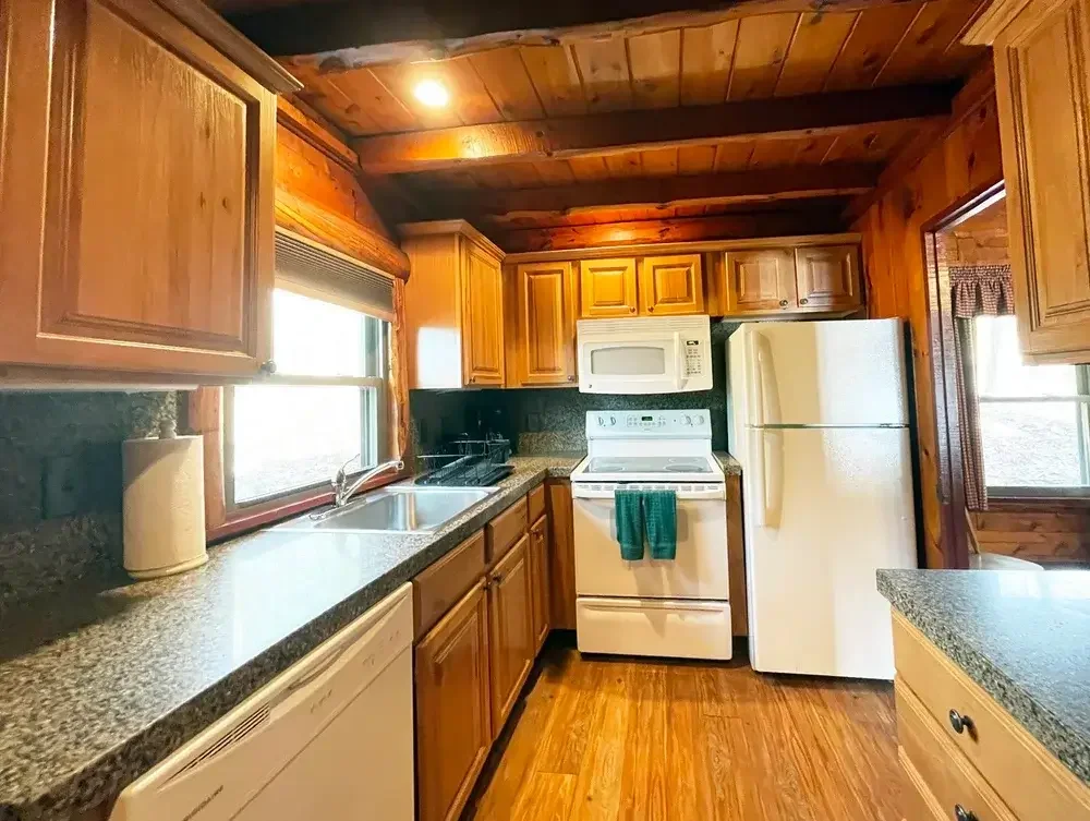 Lakeview Cabin 3 full kitchen with granite counters and dishwasher