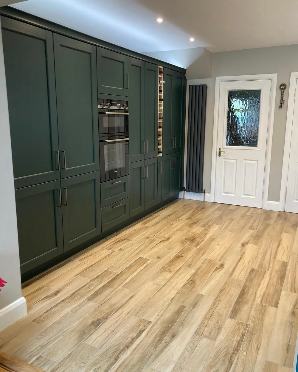 Evergreen Bradbury Beaded Shaker tall cabinets with double ovens and wine storage