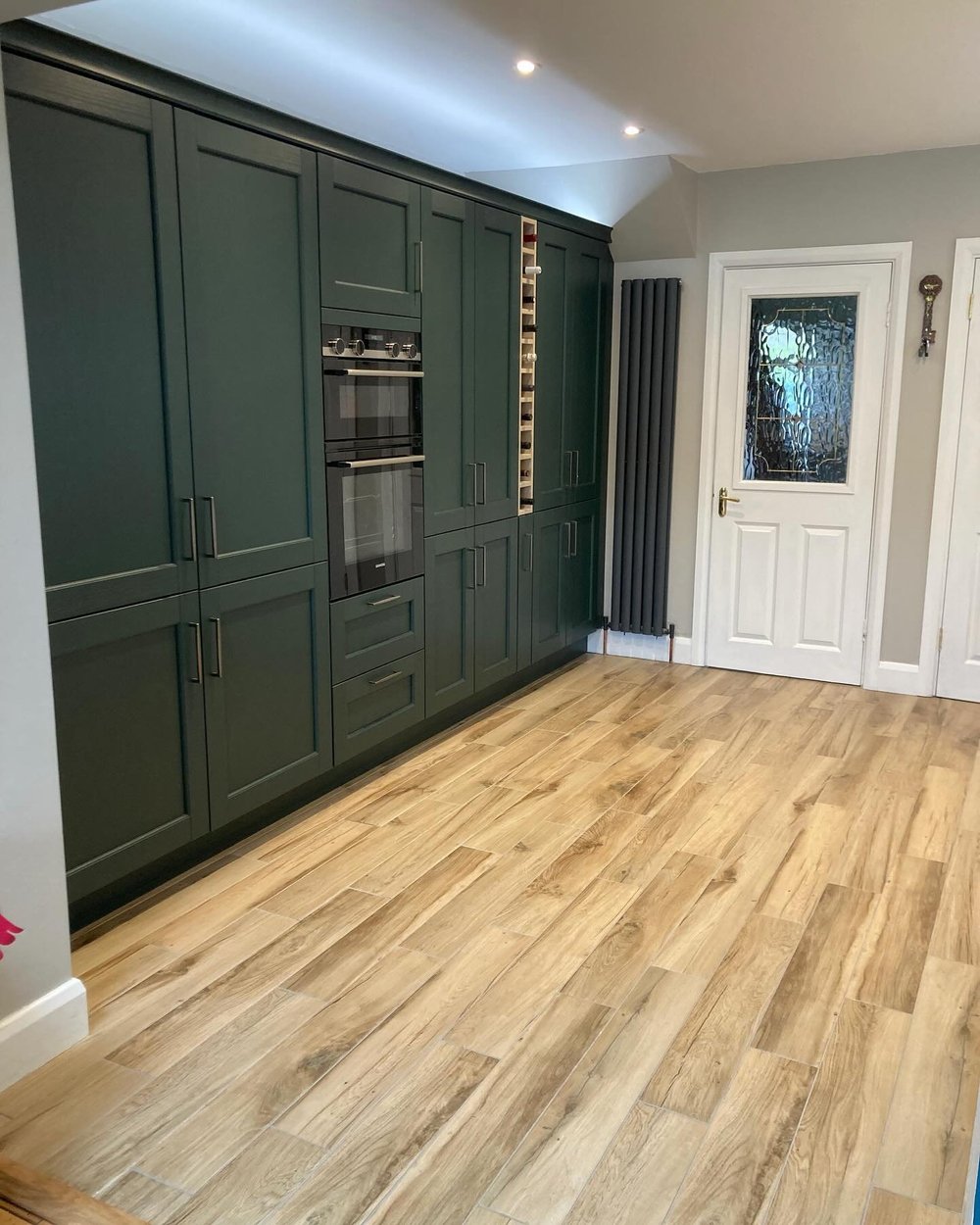 Evergreen & Taupe — completed Kitchen World kitchen