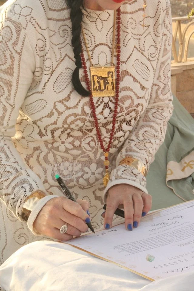 Participant signing her ordination document