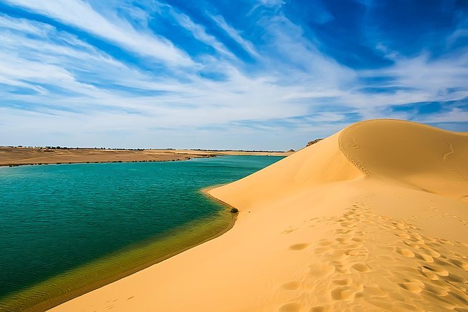 Golden dunes and water in Fayoum