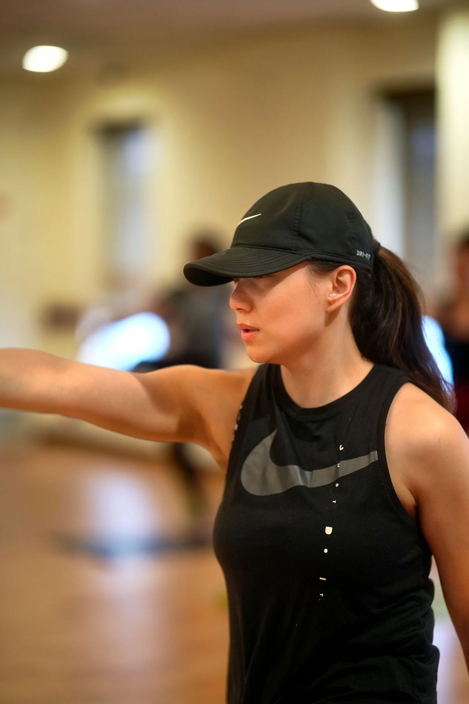 Student mid-move in a Val’s Vibe Workout class