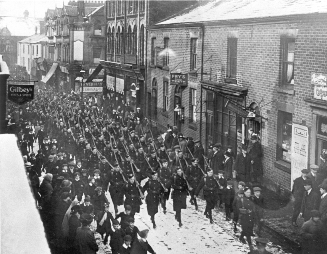 C Company of the 7th Battalion East Lancashire Regiment march up chapel street to Chorley Train Station en route to Caernarvon.