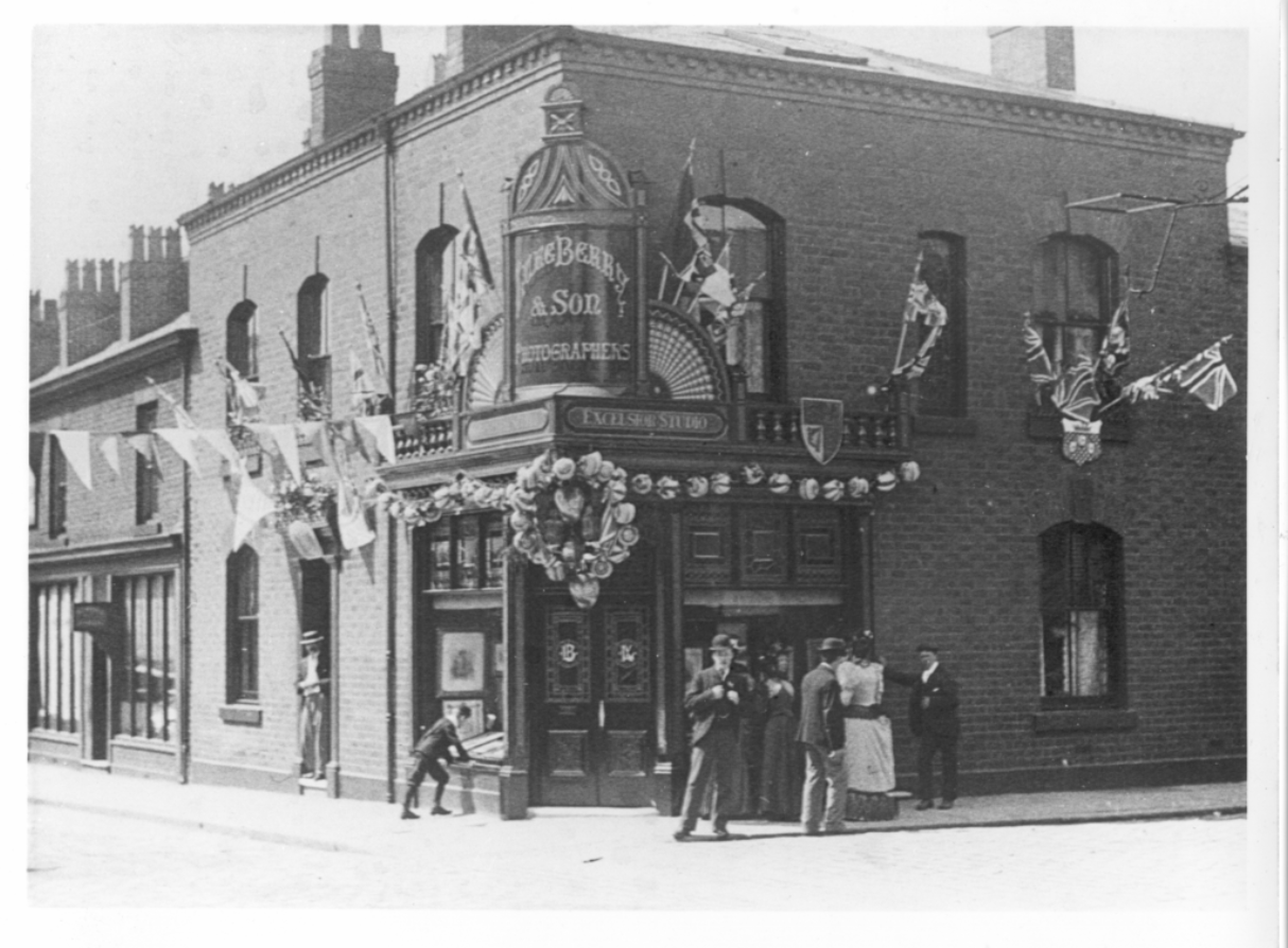 Luke Berry Photographers, Excelsior Studio, 27-29 Chapel Street, Chorley. Celebration of coronation of King George V or Edward VII. Decoration of Excelsior Studio.