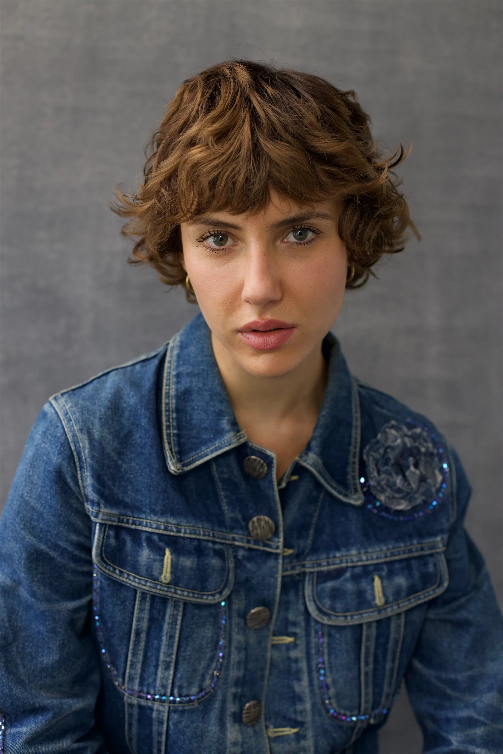 Original portrait of a woman in a denim jacket