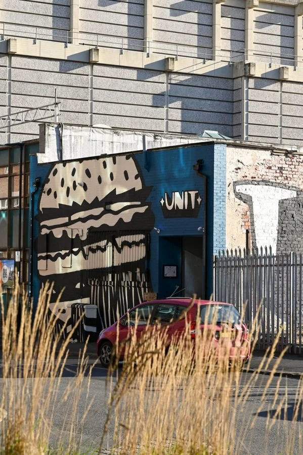 The giant burger mural and Unit sign outside Headford Street