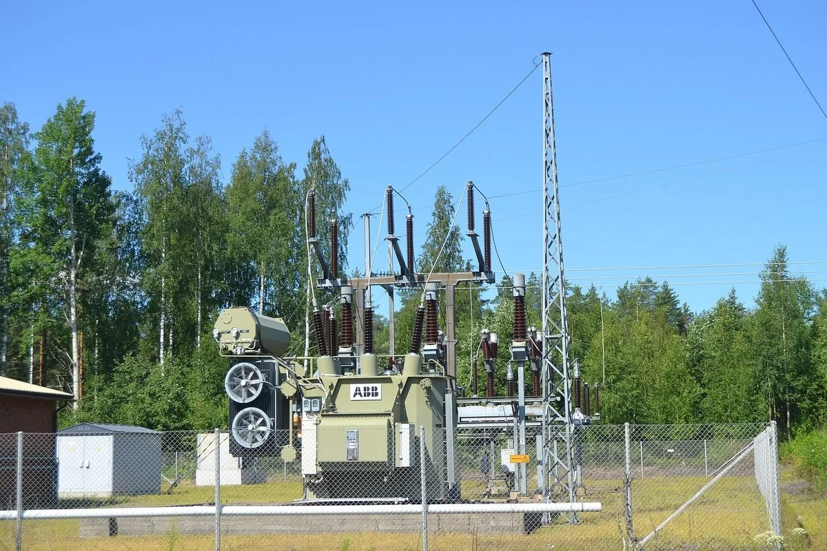 A large electrical transformer at an outdoor power substation