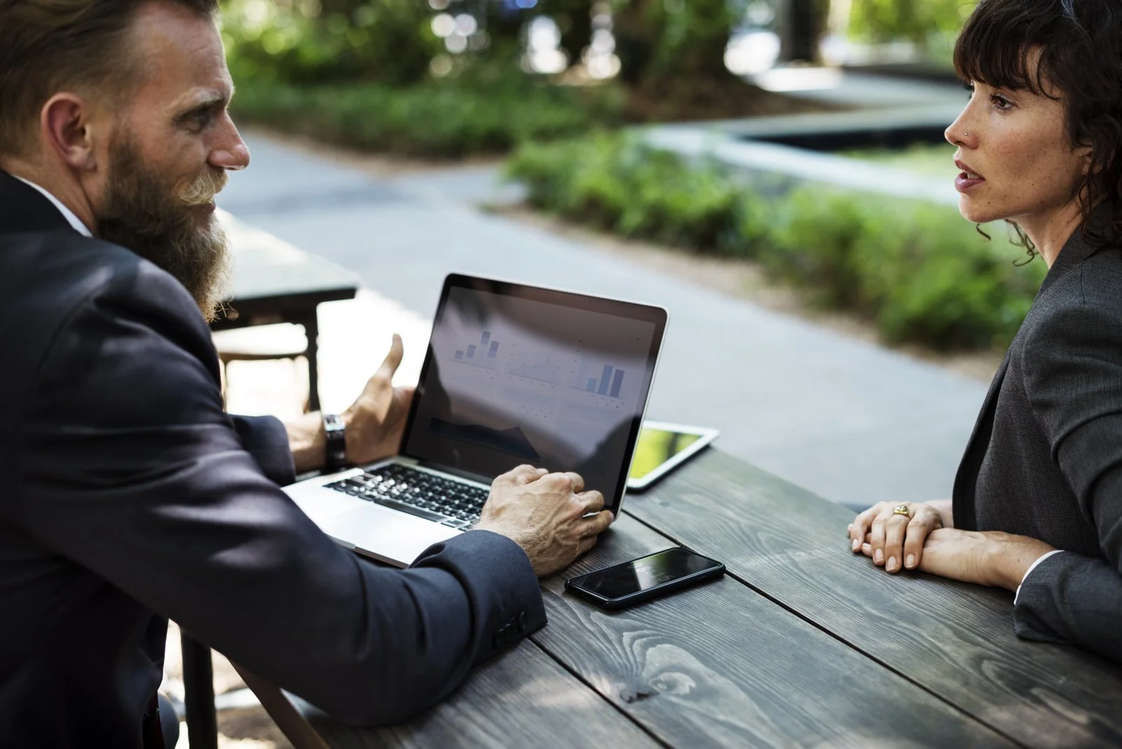 People discussing business strategy around a table