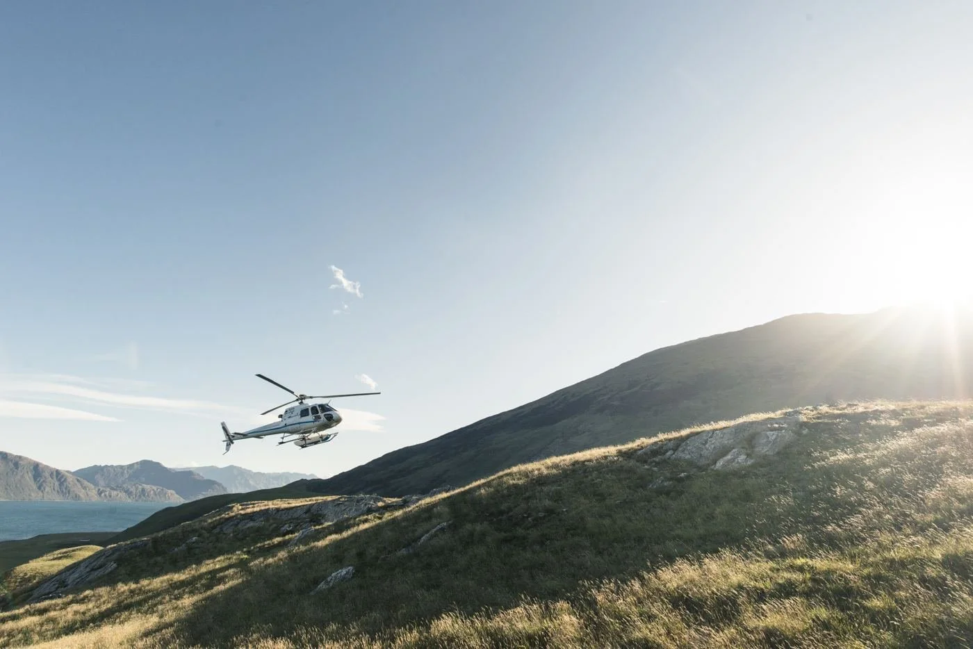 A helicopter over New Zealand high-country tussock