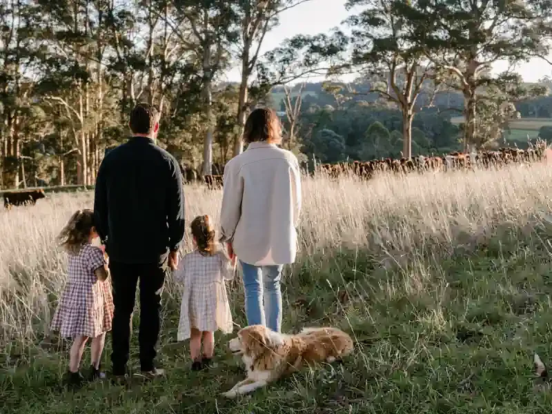 Family walking in the grass at Upland Farm