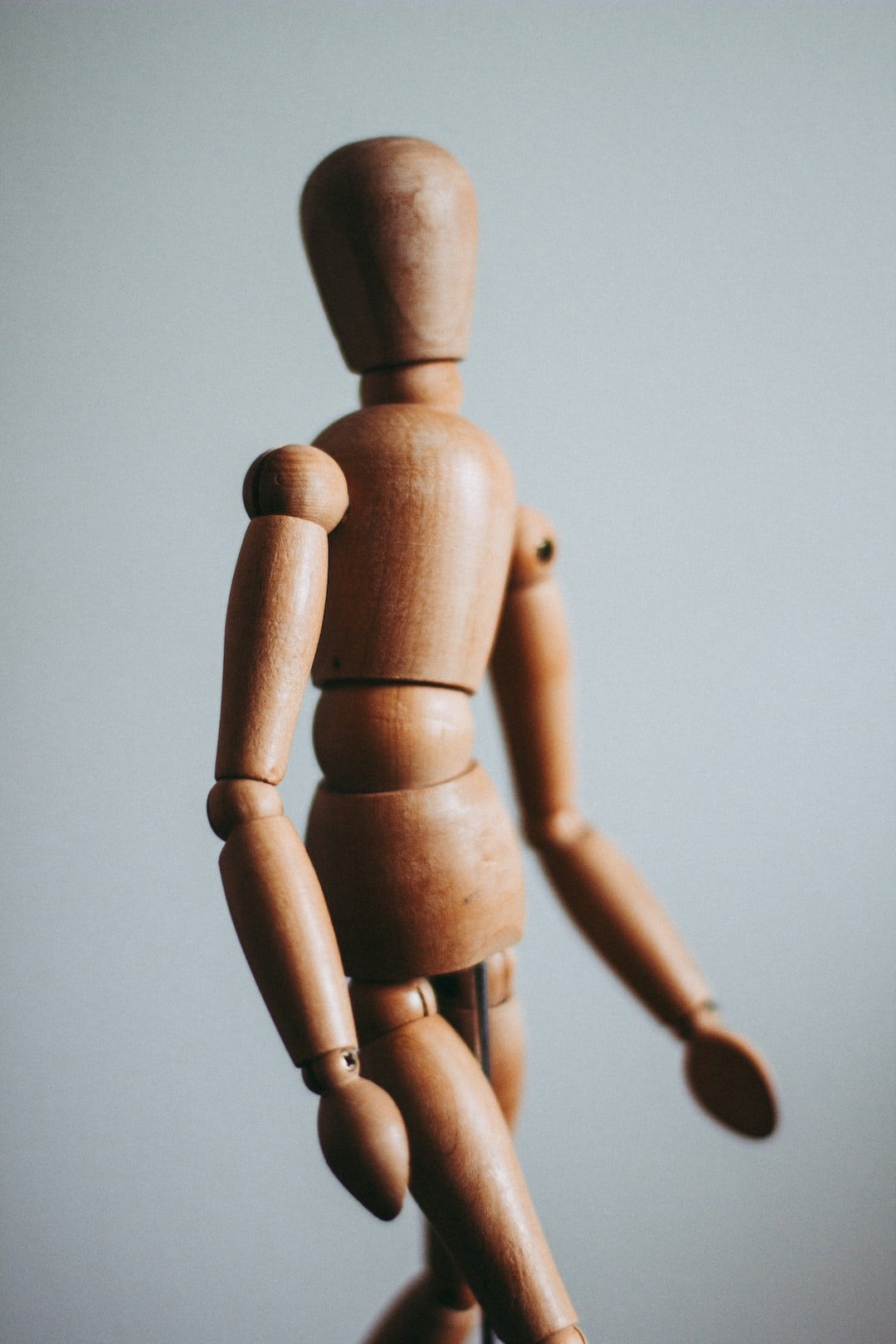 wooden figure in motion