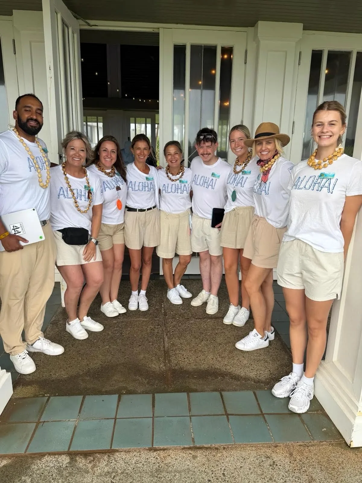 Team dressed in white on a terrace