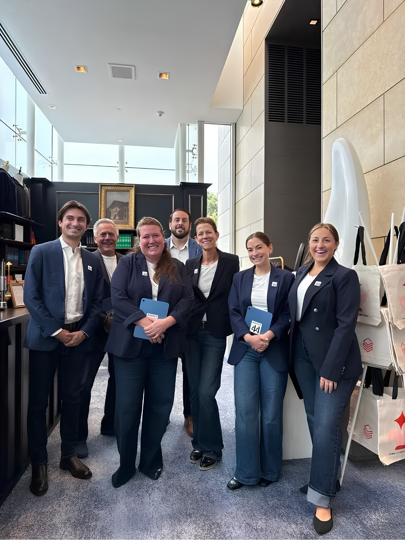 Team in suits at an event space