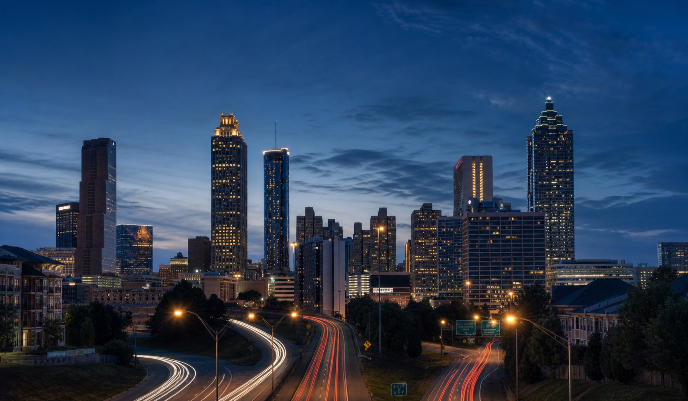 Atlanta skyline illuminated at dusk.