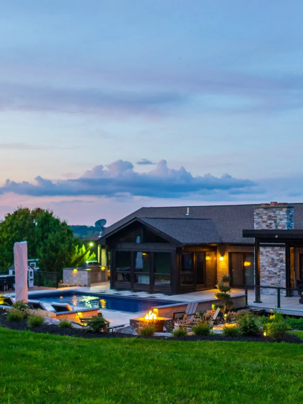 The pergola and the outdoor kitchen at dusk