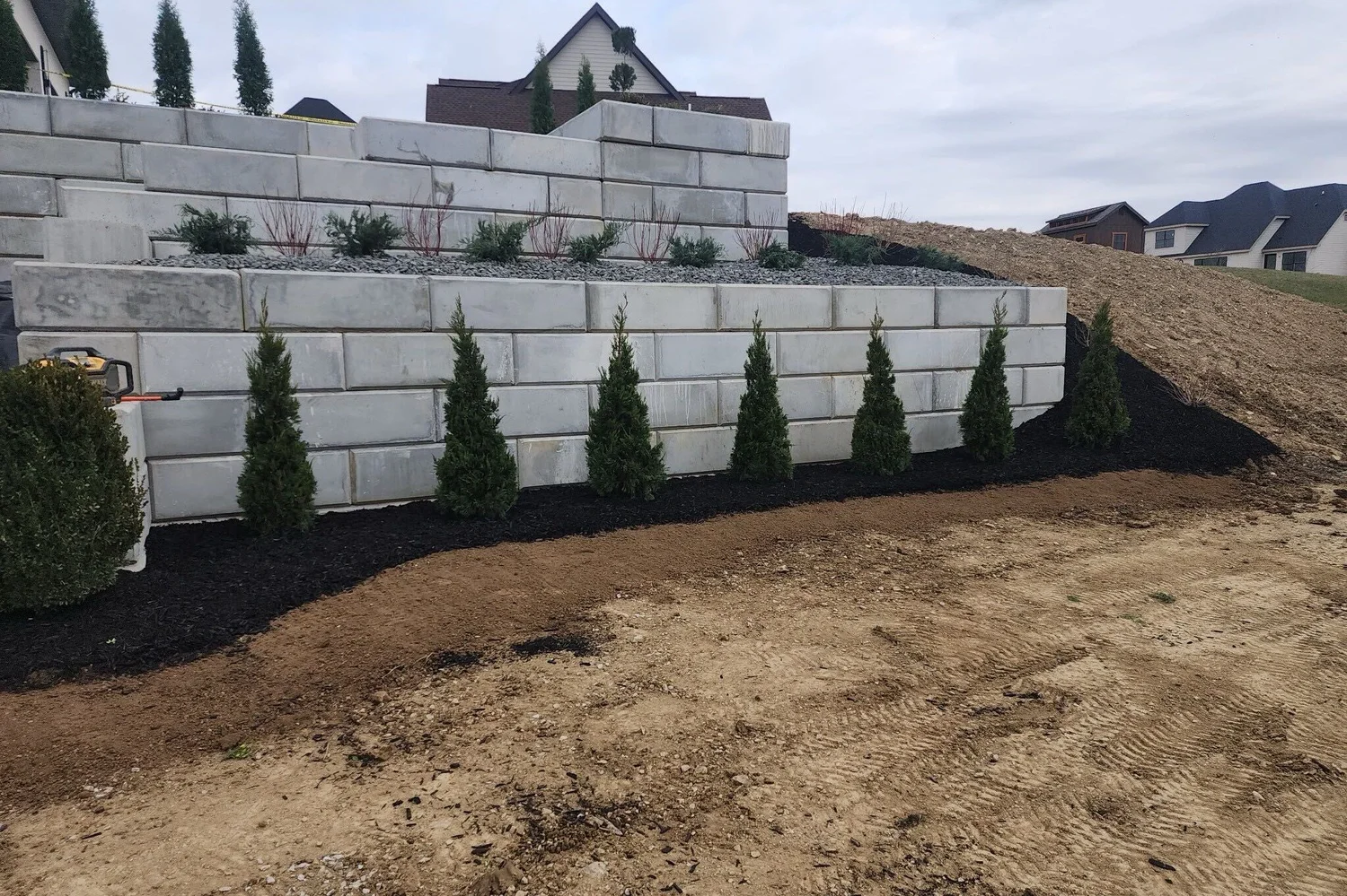 New planting along the foot of the stepped retaining walls
