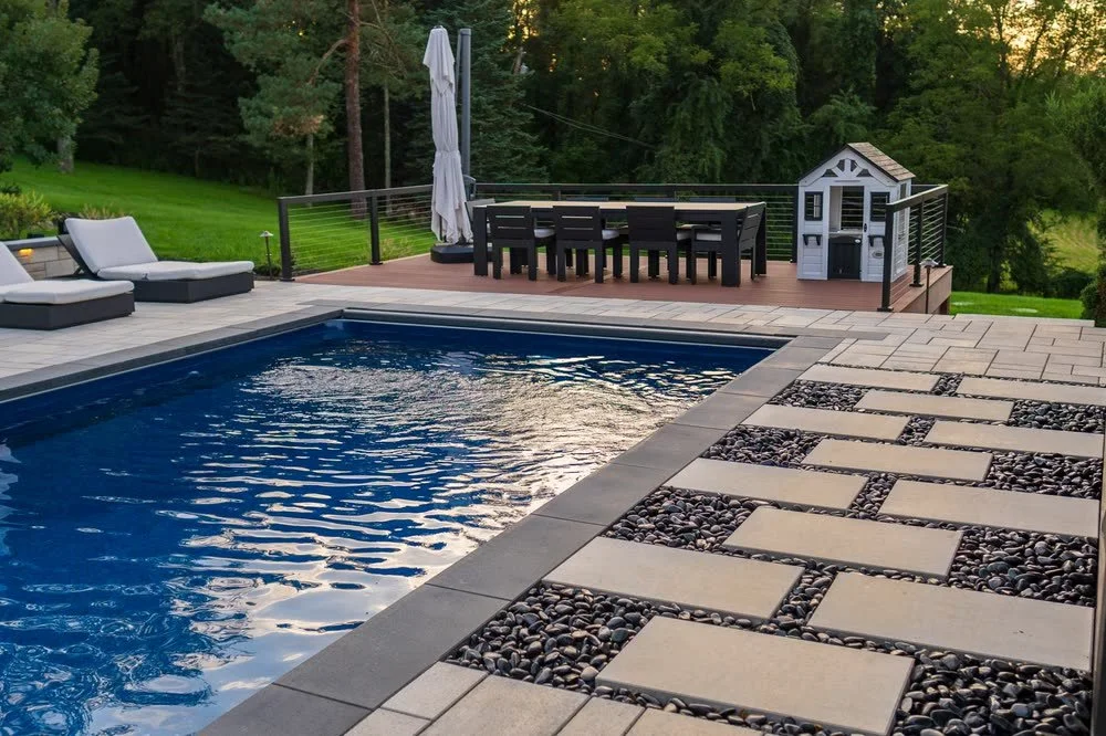 The finished pool, with step pavers over black river rock