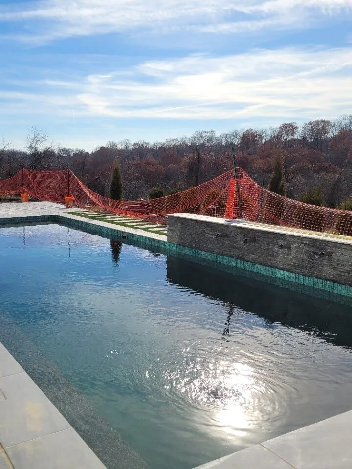 The pool filled, looking along the deck to the scupper wall