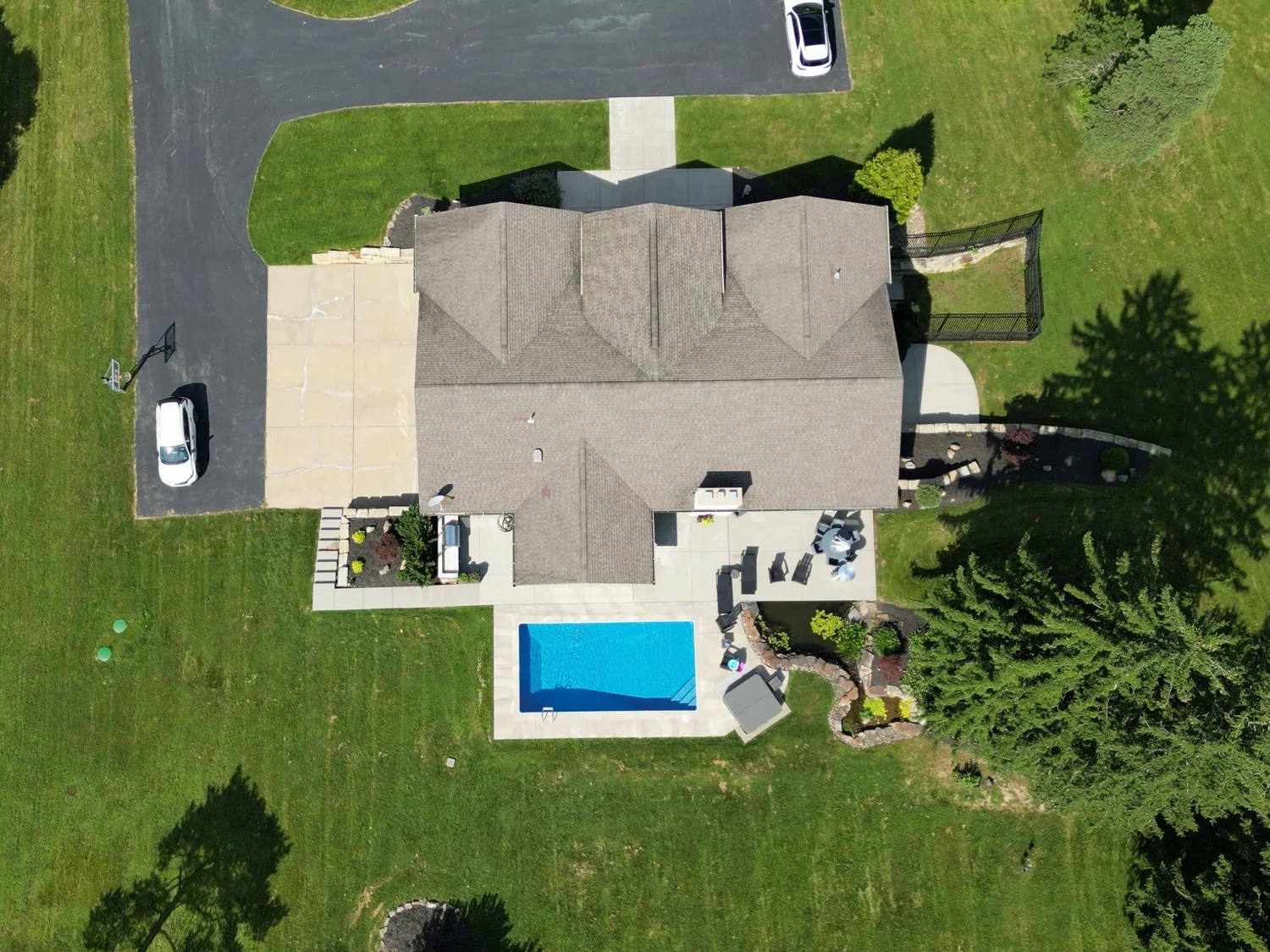 The house and the yard before work began, from the air
