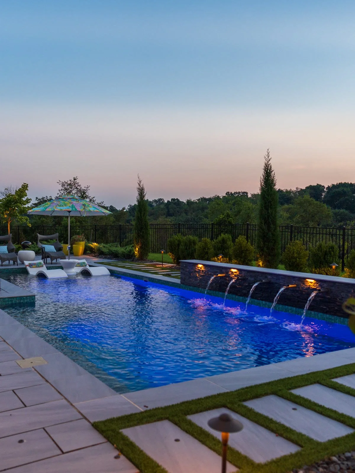The finished pool and scupper wall at sunset