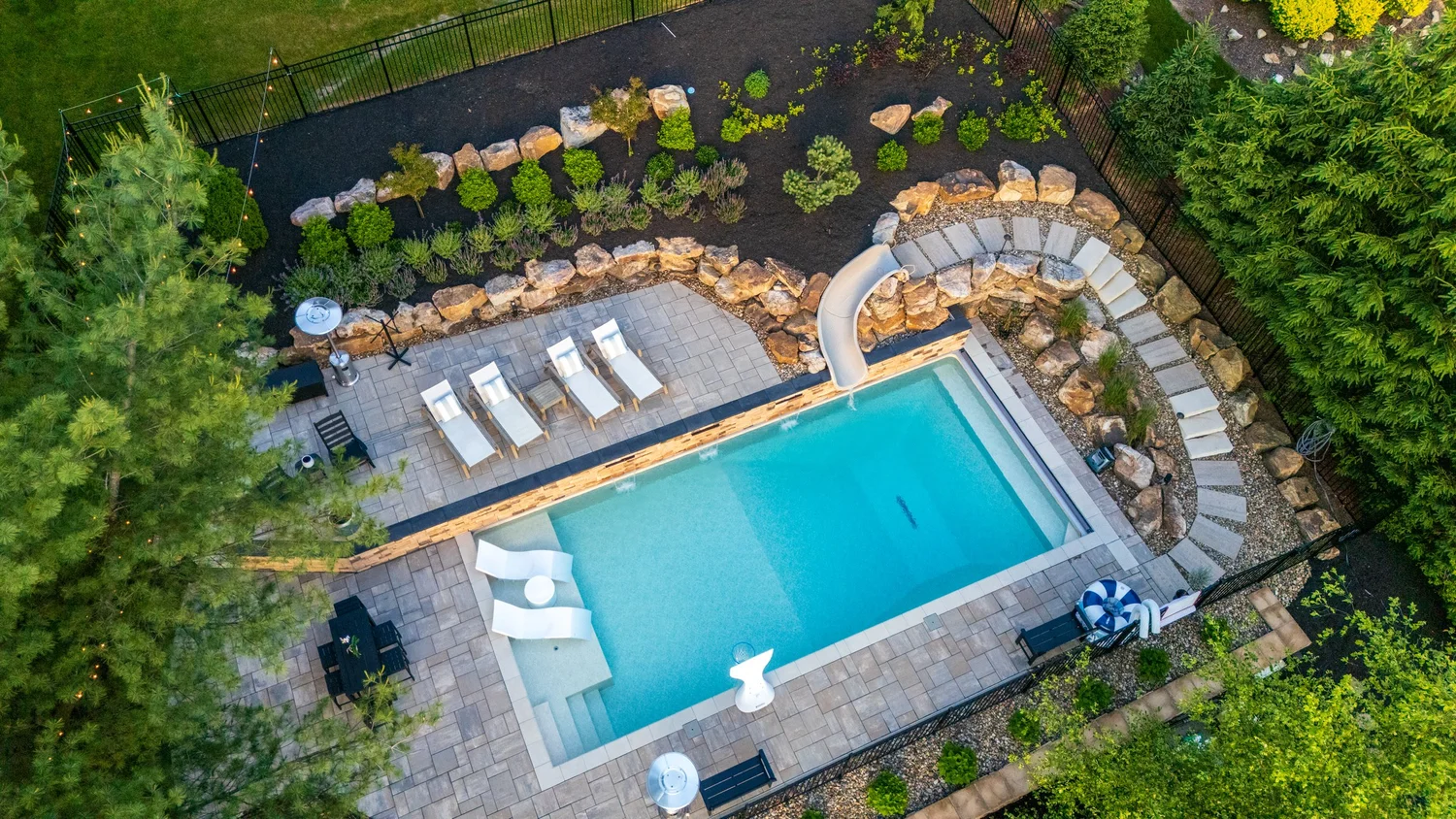 The pool terrace from the air, with the raised wall, the slide and the planting