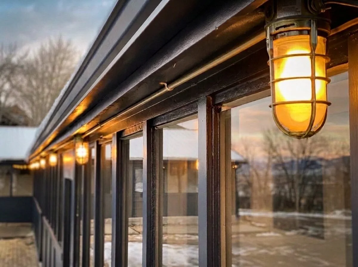 Lit walkway outside the rooms at dusk