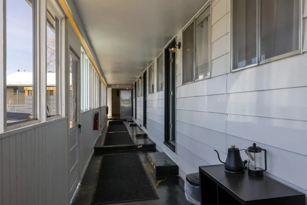 The covered walkway outside the rooms