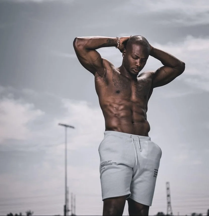 Dushane, Power House Fitness coach, in grey training shorts