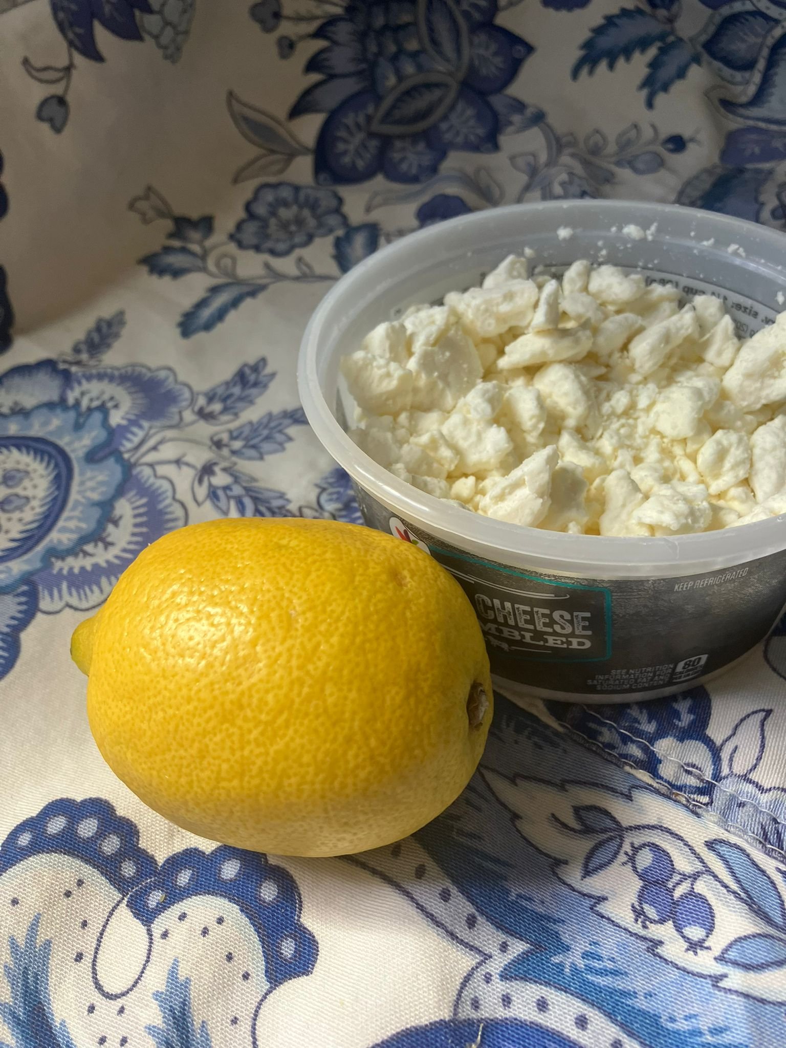 Feta and lemon on cutting board