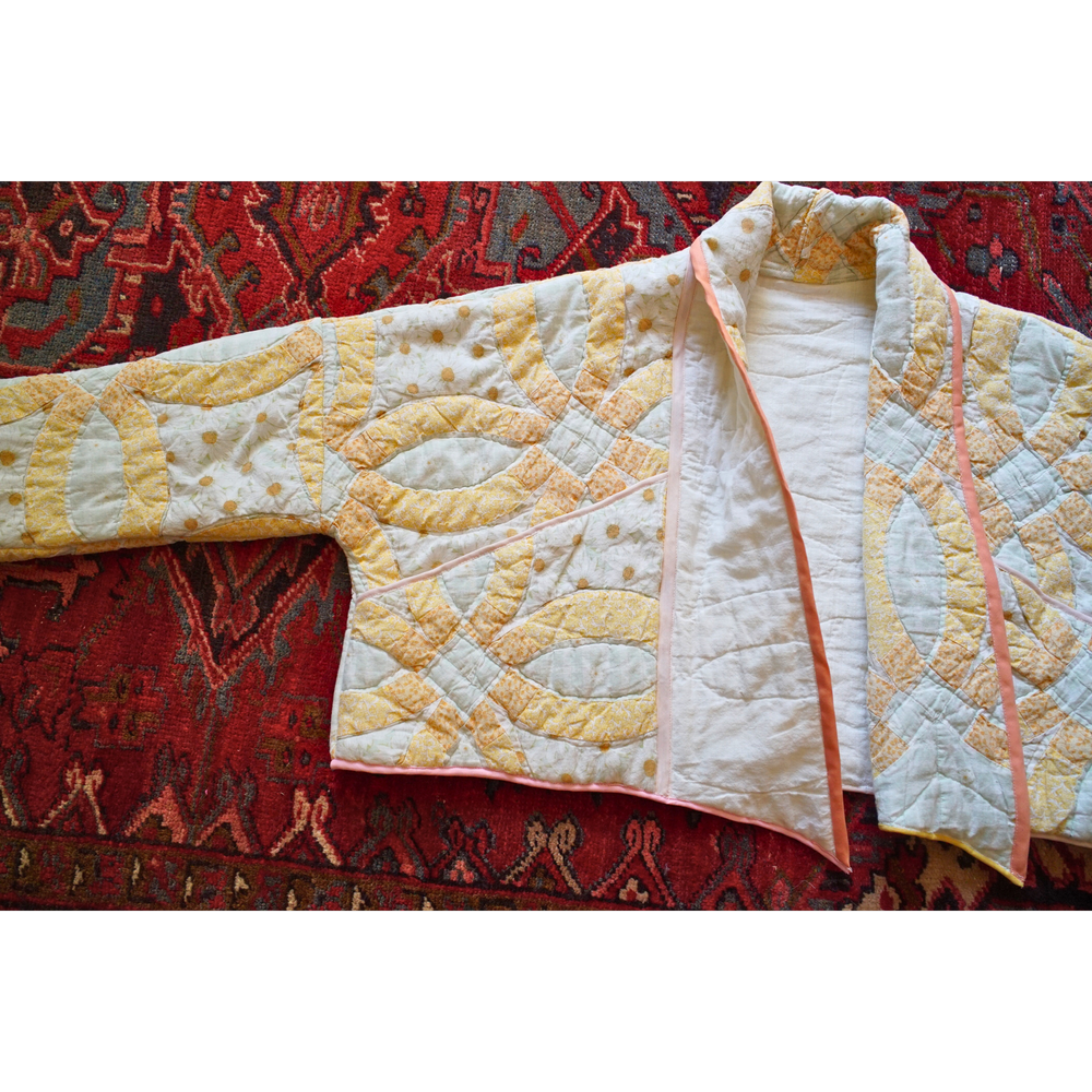 Deep patch pockets on an upcycled patchwork quilt jacket