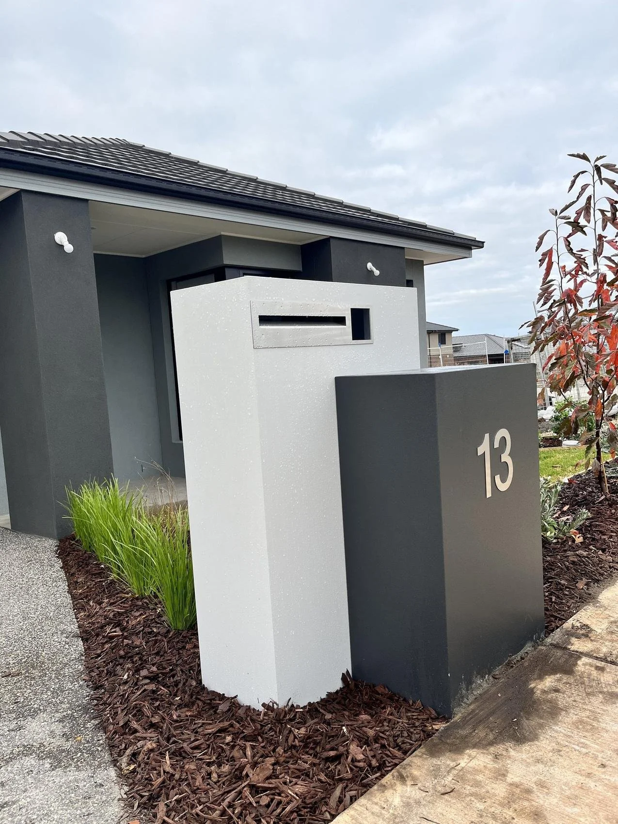 Front yard with letterbox and fresh planting