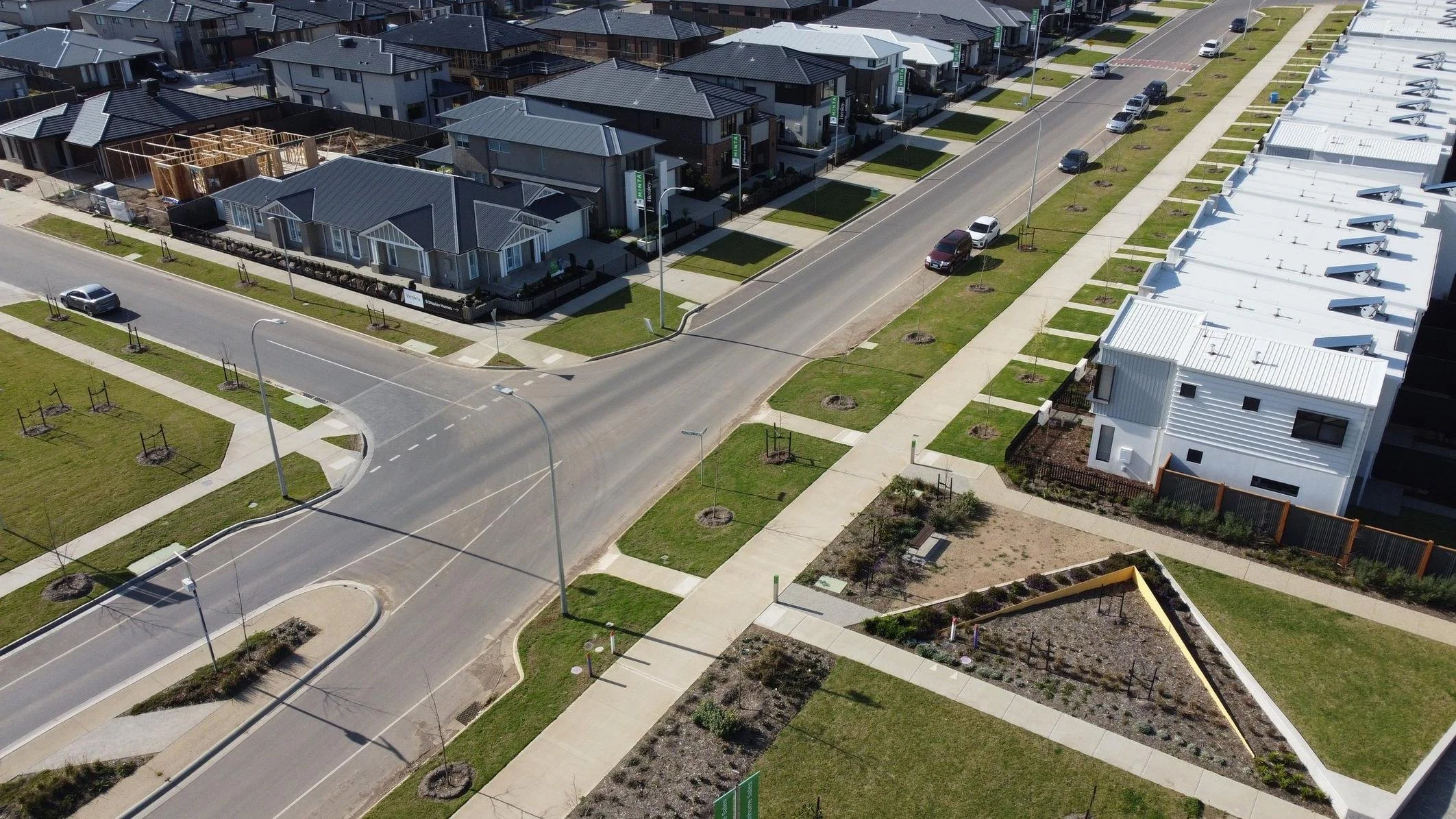 Drone view of estate streets with new nature strips and street trees in Melbourne