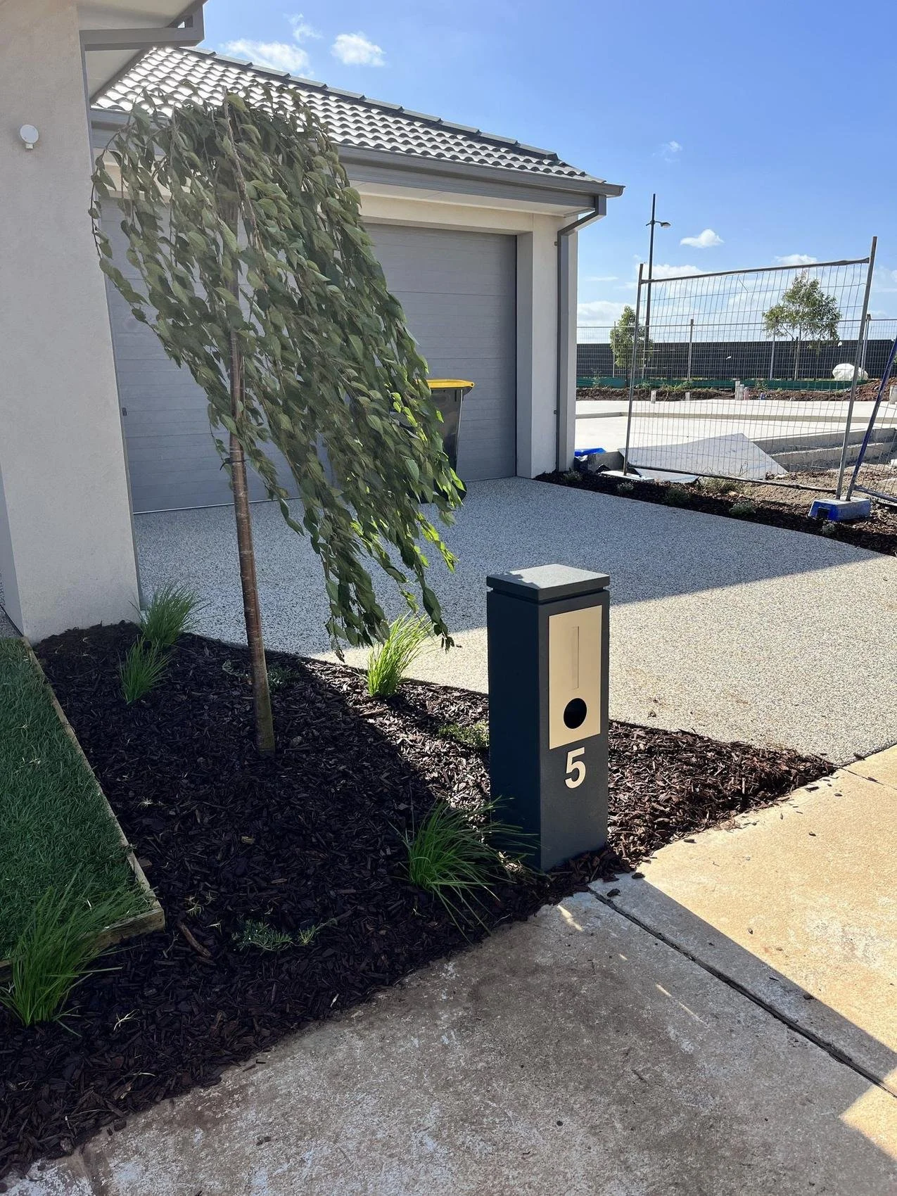 Completed front yard with feature tree and letterbox