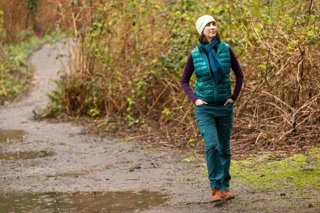 Rebecca Beltran on a forest path — somatic coaching Seattle