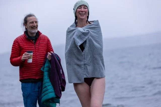 Laughing joyfully wrapped in a towel after cold plunge — Puget Sound, Vashon Island