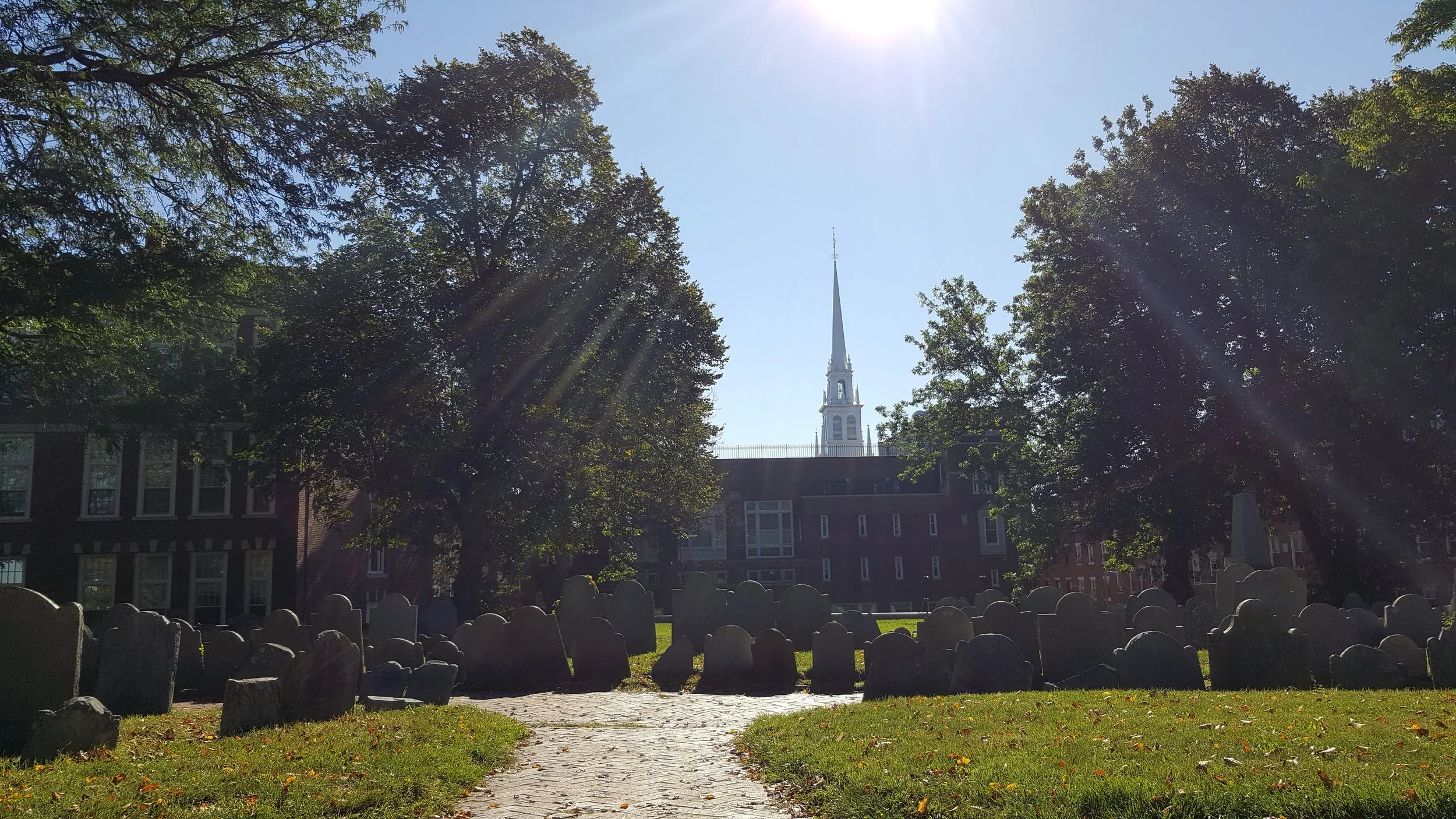 Old North Church steeple with sun above it from Copp's Hill Burying Ground