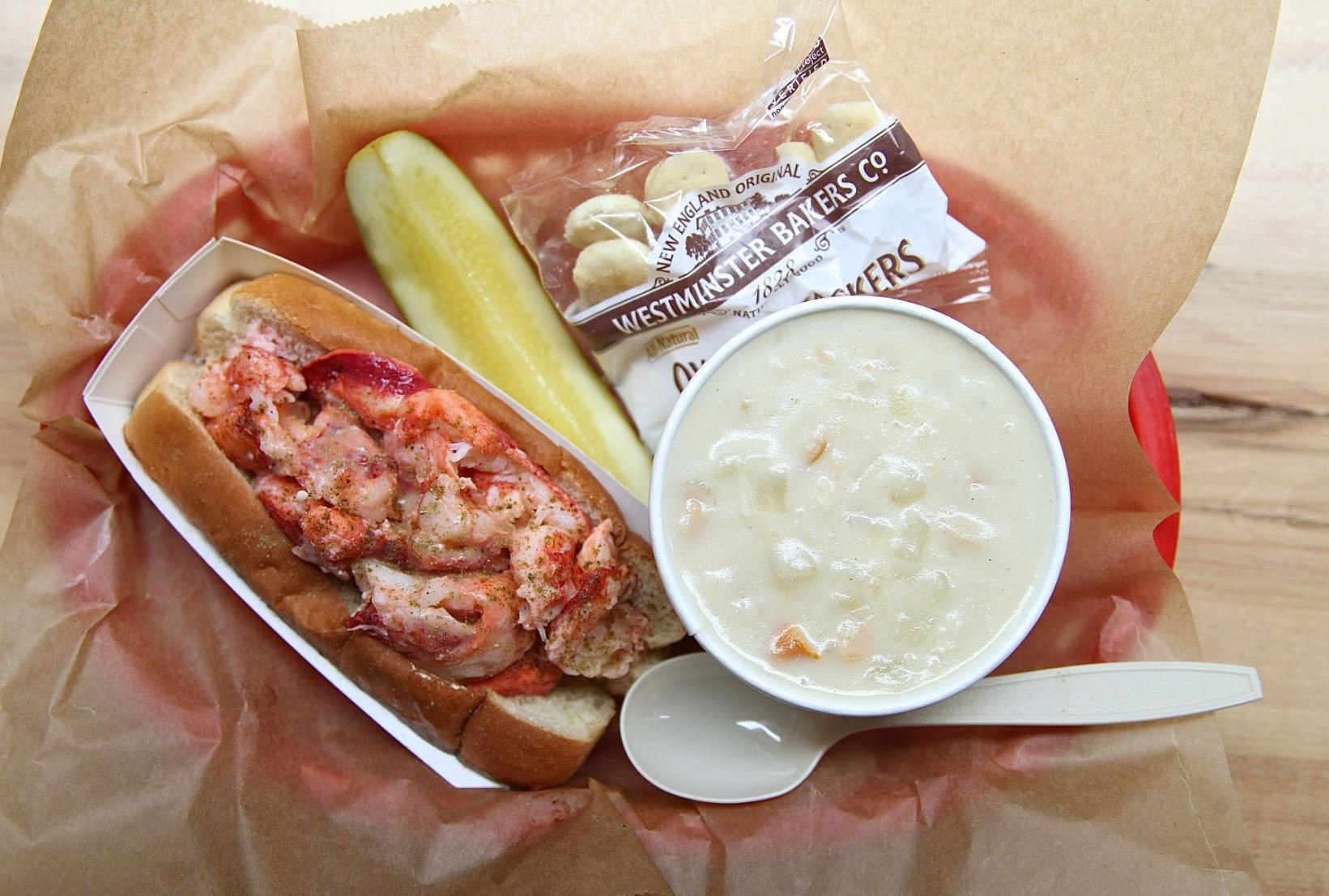 Lobster roll, chowder, and pickle