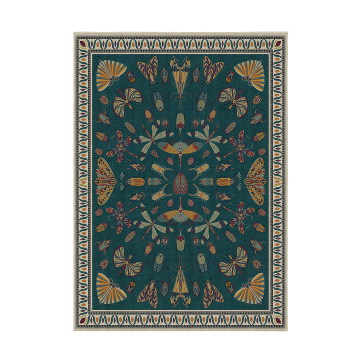 It's a bug's life. Our Iris Apfel Flutterby Rug showcases a diverse mix of extravagant insects. Rich with a jewel-tone colorway on a teal background, this intricate design is inspired by the fashion icon's unique and bold sense of style. Water-resist