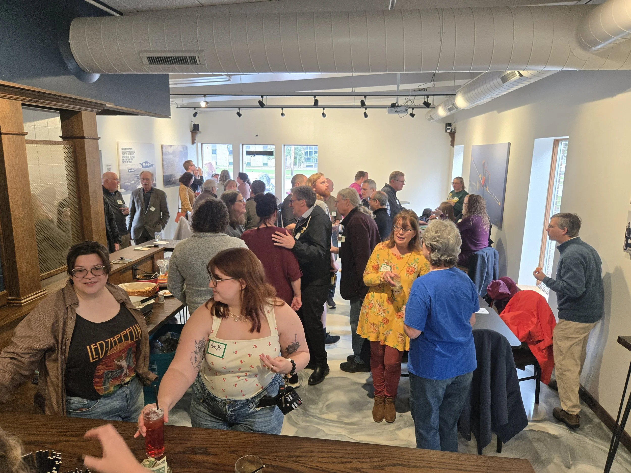 Guests enjoying a private event in the Ready Room at Sturgeon Spirits