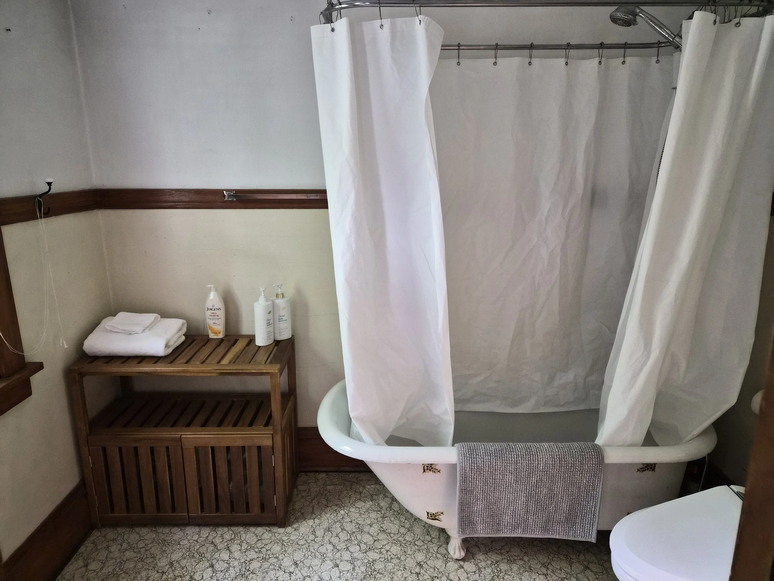 Bathroom at The Angel's Share featuring a clawfoot tub and shower