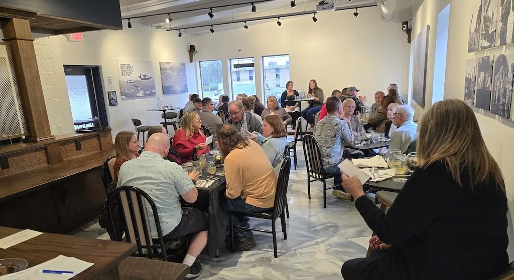 A seated private dinner in the Ready Room at Sturgeon Spirits