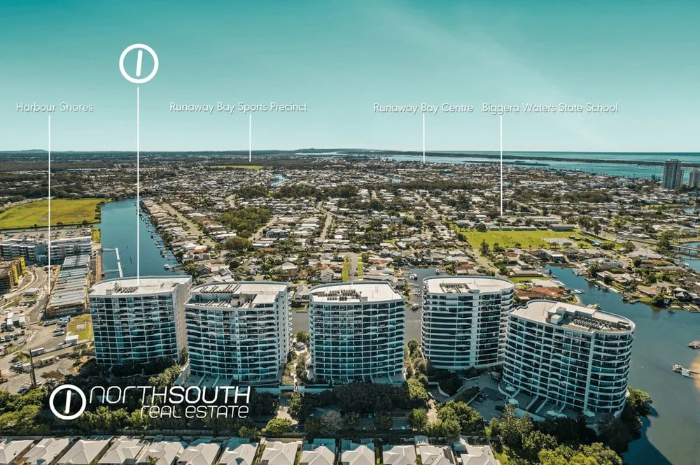 Aerial view of the Waterpoint Residences towers beside Harbour Town, Biggera Waters