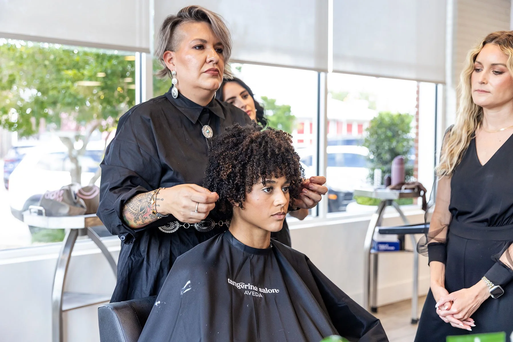 Defined curly hair styled at Tangerine Salon using Aveda Nutriplenish products