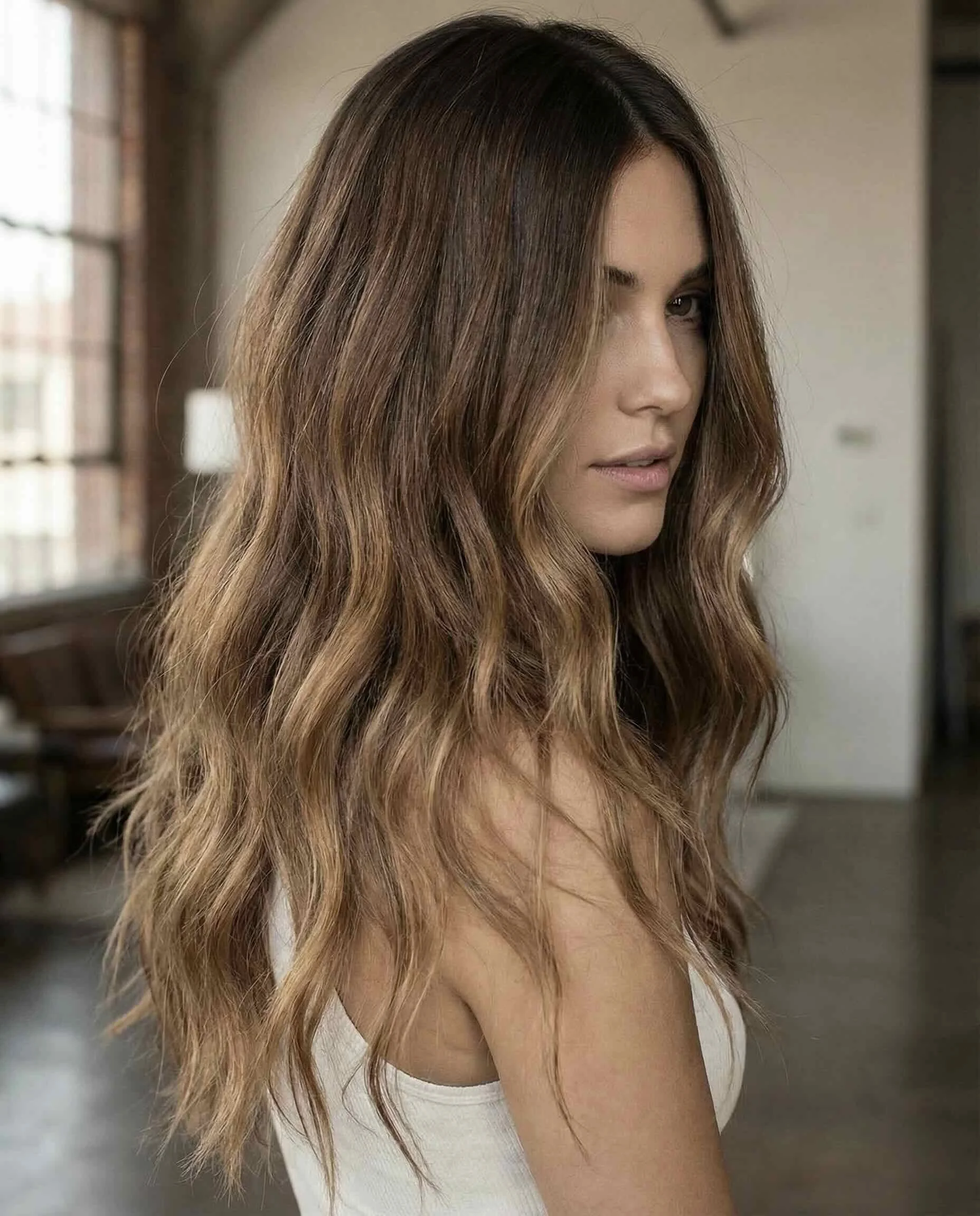 Warm blonde balayage by Tangerine Salon Frisco colorists near Prosper