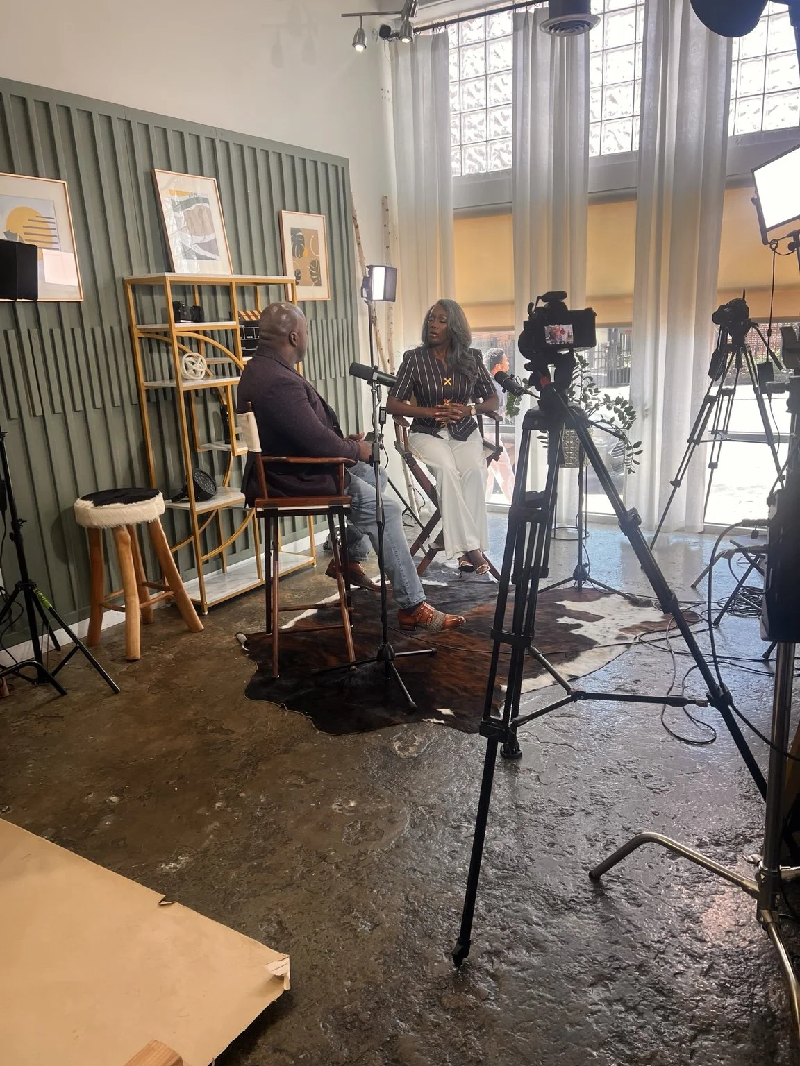 Interview production with cameras, lights and microphones.